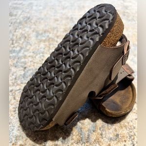 Size 11 Birkenstock sandals. Worn a lot but broken in. Not defects.